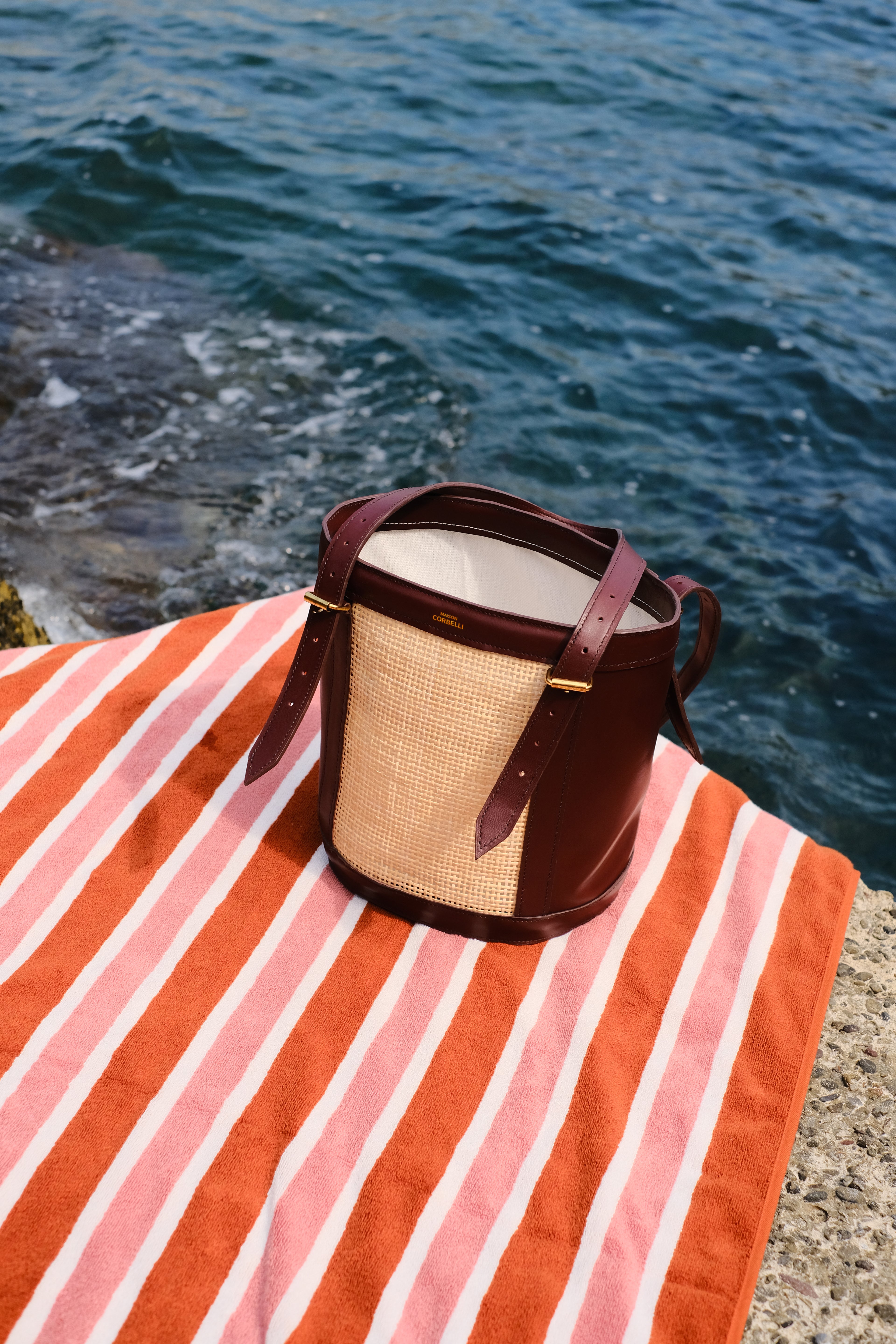 Alma bag, side view, Model, Street wear, Bucket bag, Burgundy, Rattan, Flowers, Woman, Burgundy, Hand bag, mediterranean vibe, Premium leather, Unique design, bag, Maison Corbelli, Luxury, Beach view 