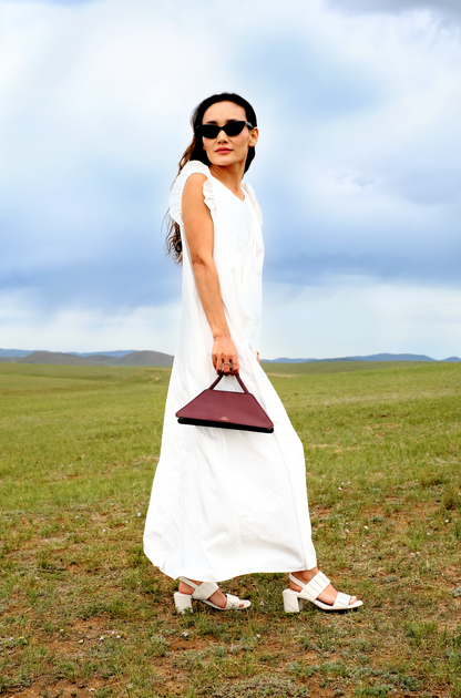 Elie mini bag, side view, Model, Field View, Burgundy, Clutch bag, Hand bag, mediterranean vibe, Premium leather, design, Woman model, leather, Unique design, Maison Corbelli, Luxury, 