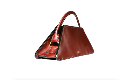 Elie mini bag, side view, Model, Studio, Burgundy, Clutch bag, Hand bag, mediterranean vibe, Premium leather, Unique design, Maison Corbelli, Luxury