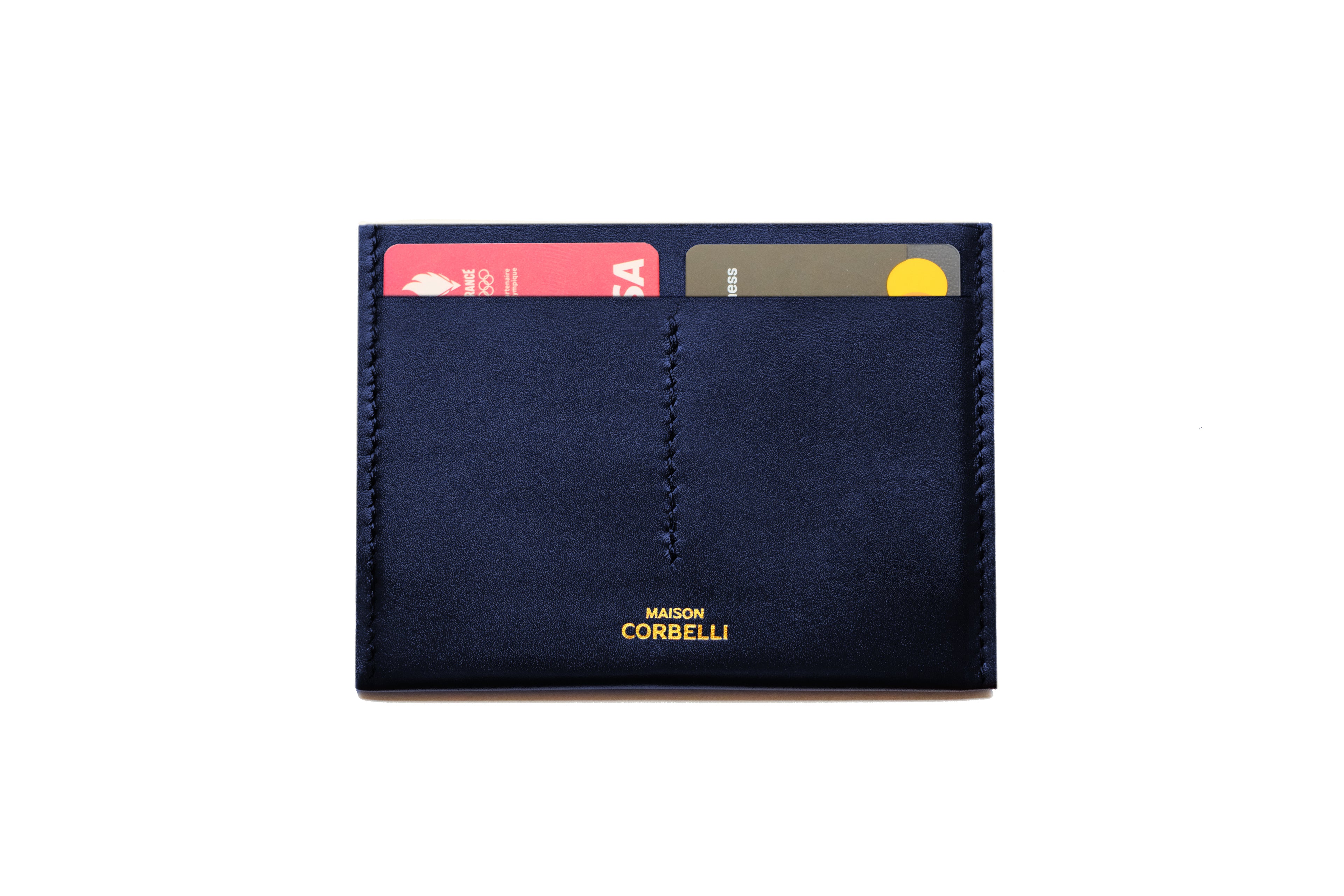 Navy blue wallet with 'Maison Corbelli' branding on a white background One cardholder, navy blue colour, on a white background, Wally wallet, top view, Pure leather, black colour, Passport size, studio photo, Close up open, 2 visible cards
