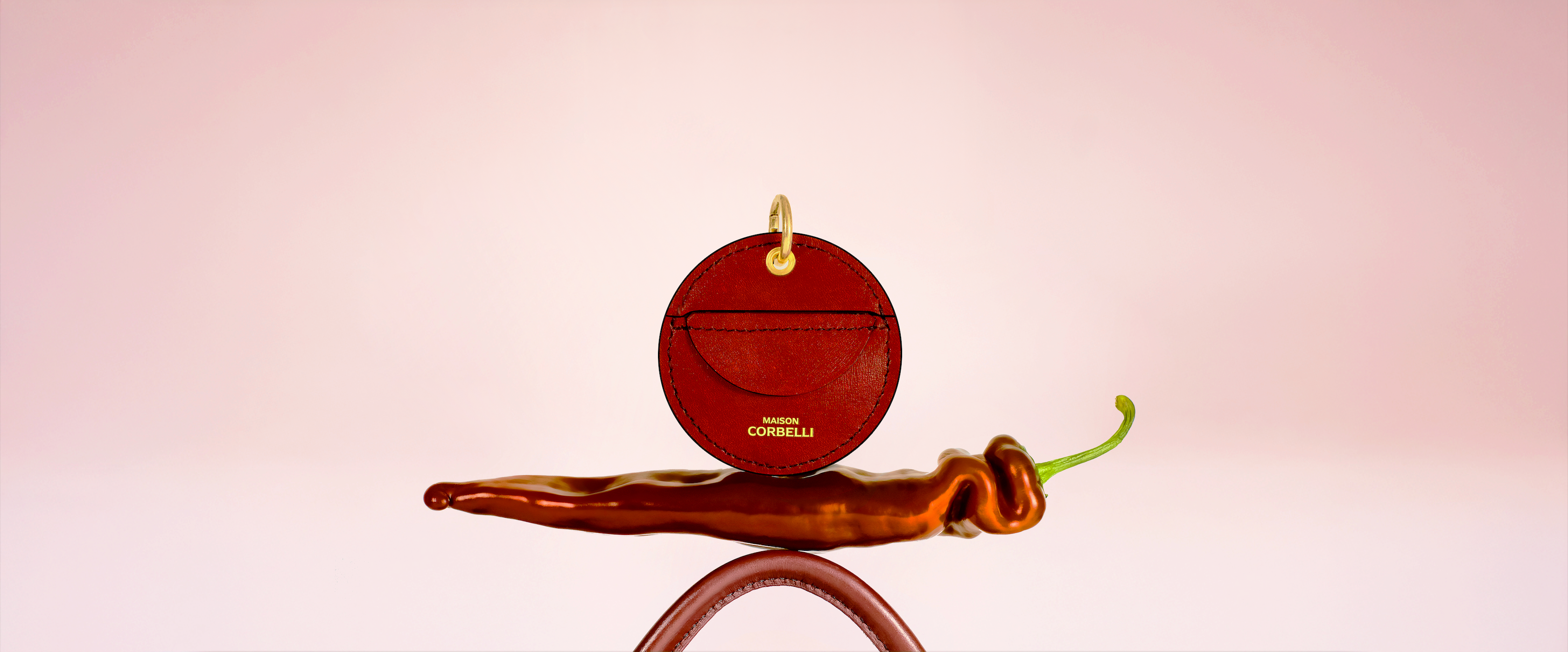 Oto coin holder by Maison Corbelli meticulously hand-crafted in Italy from smooth burgundy calf leather. Its sculptural silhouette and clean geometry express modern minimalism and timeless luxury, shaped entirely by artisans in the Maison Corbelli atelier.